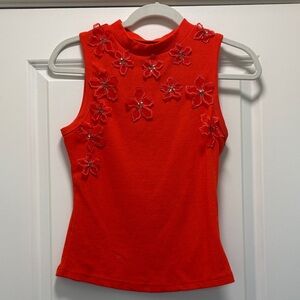 Orange ribbed tank top.